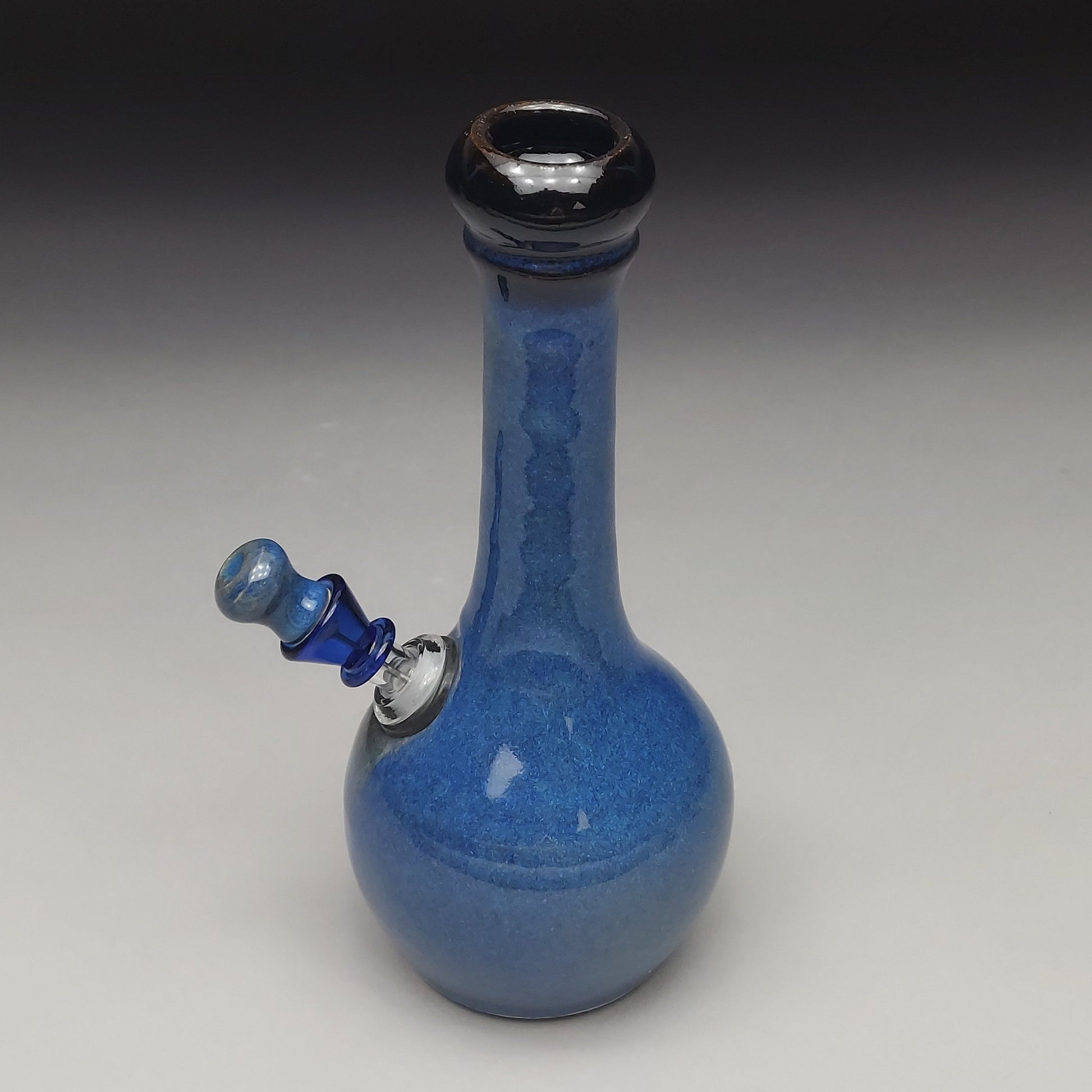 Blue ceramic water pipe on a gray background